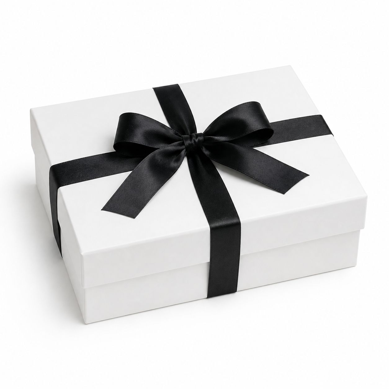 White gift box tied with a black satin ribbon on a plain background
